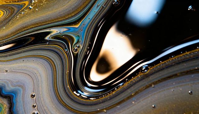 Revealing iridescent oil film macro featuring metallic swirls, concentric color bands