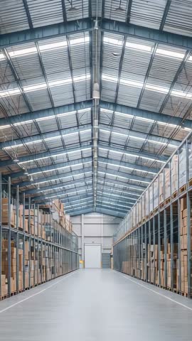 Vertical warehouse aisle tracking shot showing industrial racking pallet storage logistics operation
