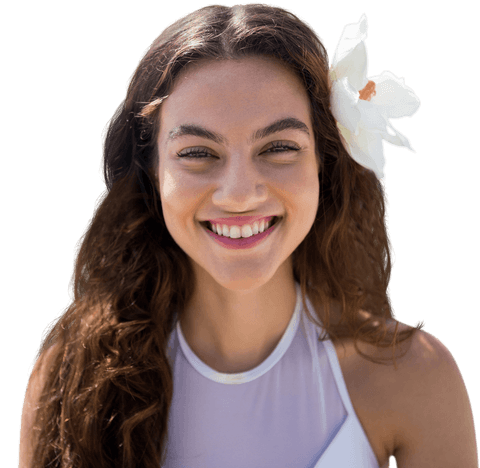 Cheerful Caucasian Woman with Flower Accentuates Natural Beauty