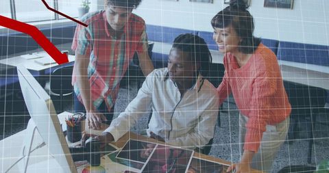 Colleagues Analyzing Business Data Trends in Office