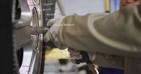 Mechanic Using Impact Wrench with Futuristic Code Integration