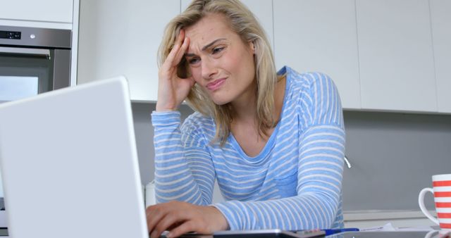 Stressed Woman Working on Laptop at Home Kitchen - Download Free Stock Images Pikwizard.com