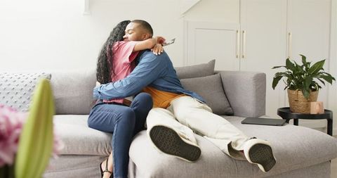 Excited Couple Shares Baby News with Scanned Ultrasound at Cozy Home