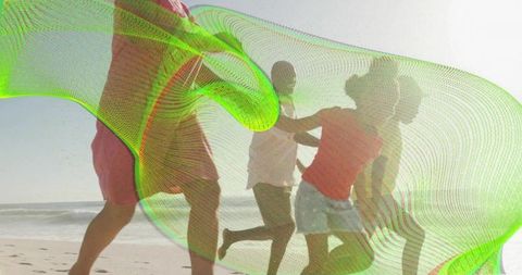 Multigenerational family running on beach with neon mesh motion and backlit silhouettes