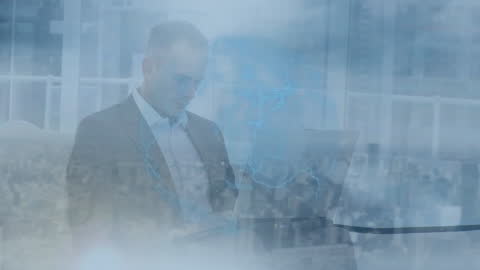 Holographic Globe Overlapping Businessman Using Laptop