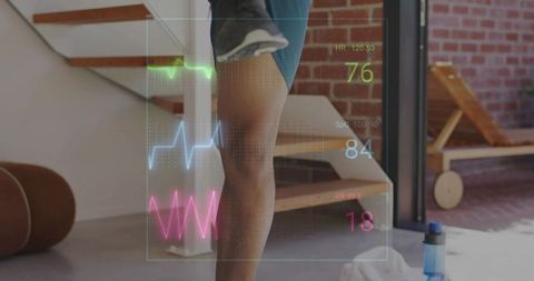 Male balancing on step in home gym with wearable hud overlay showing heart rate spo2