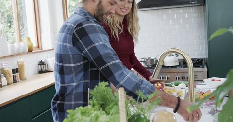 Couple Preparing Healthy Dinner Together in Modern Kitchen