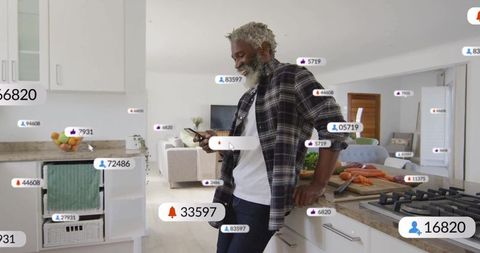 Stylish man engaging with social media in modern kitchen setting