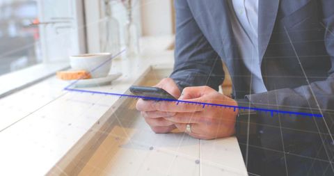 Businessman Utilizing Smartphone with Overlayed Graph