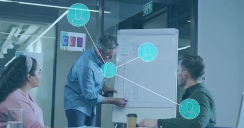 Business team analyzing data with network connections overlay