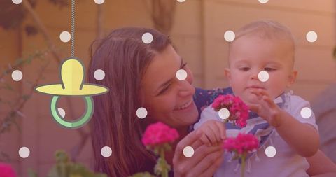 Joyful Mother and Baby Bonding Outdoors Amidst Greenery