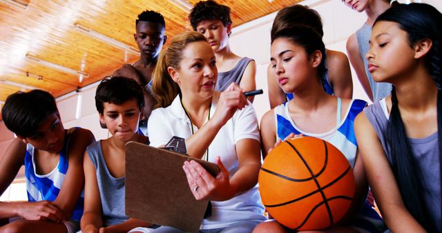 Basketball Coach Giving Strategy Tips to Teenagers - Download Free Stock Images Pikwizard.com