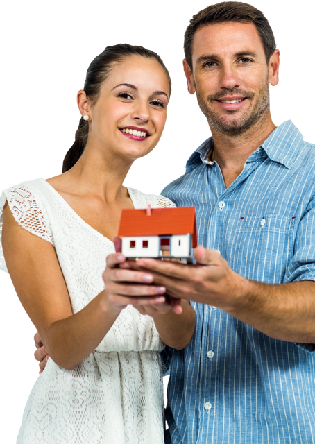 Confident Couple Proudly Holding Small House Model On Transparent Background - Download Free Stock Videos Pikwizard.com