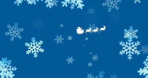 Silhouette of Santa Claus on Sleigh with Reindeer over Blue Winter Scene