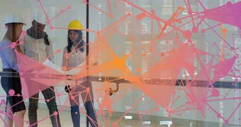 Architects Reviewing Plans with Futuristic Digital Interface Overlay