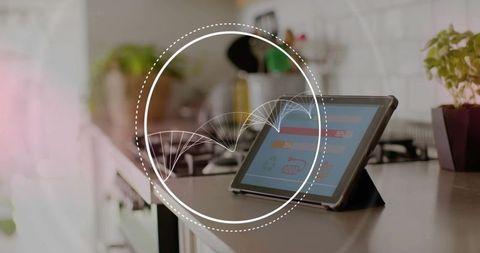 Tablet displaying smart kitchen dashboard with waveform overlay on modern countertop