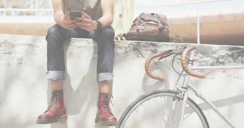 Urban Lifestyle: Young Man with Bicycle in City Plaza