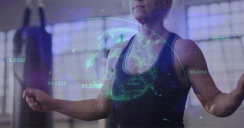 Mature woman jumping rope with augmented reality fitness metrics overlay in gym studio