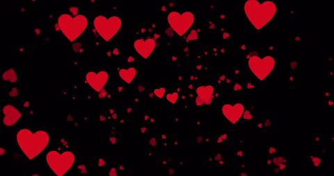 Floating Red Hearts on Black Background for Romantic Themes