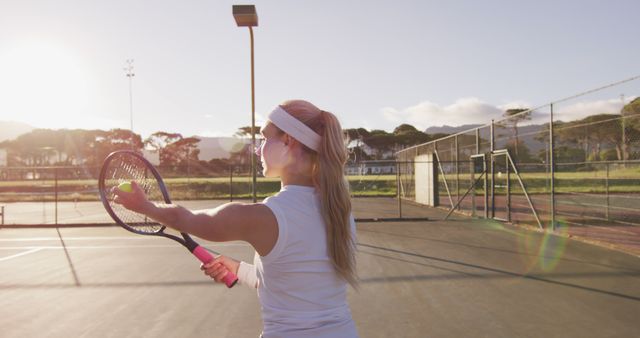 Woman Practicing Tennis Serve at Sunrise - Download Free Stock Images Pikwizard.com