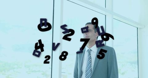 Businessman gazing through office window with floating numerals over city skyline