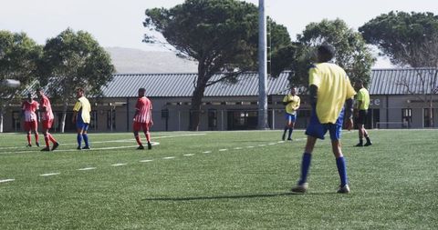 Young Soccer Players Practice Team Strategy on Field