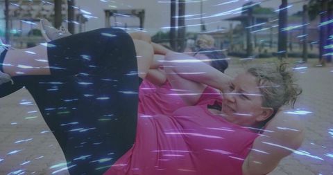 Dynamic energy of women exercising at outdoor urban gym