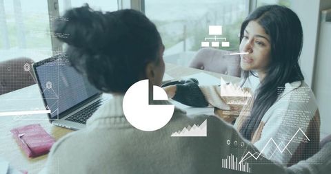 Mentee and Mentor Analyzing Data Charts with Laptop and Notebook