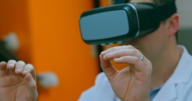 Man using virtual reality headset for immersive experience in laboratory - Download Free Stock Images Pikwizard.com