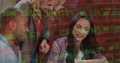 Diverse team analyzing digital trends with stock market overlay