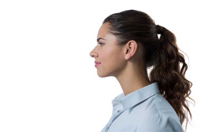 This image features a thoughtful female executive in a profile view against a white background. She is wearing professional office attire and has her hair tied in a ponytail. This image can be used for business-related content, corporate presentations, leadership articles, and professional profiles.