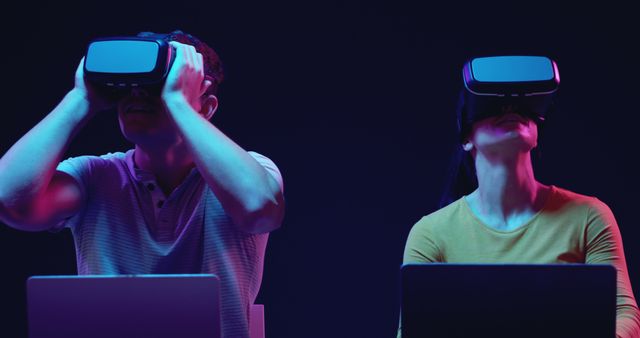 Male and Female Using VR Headsets Together with Laptops - Download Free Stock Images Pikwizard.com