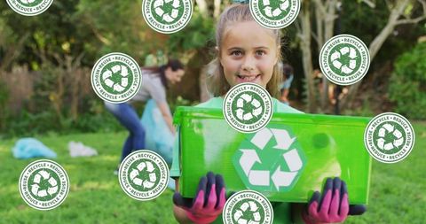 Smiling Girl Holding Recycling Bin Outdoors for Eco Conservation - Download Free Stock Images Pikwizard.com