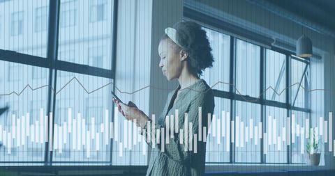 Businesswoman Engaged with Mobile Analytics in Office Setting