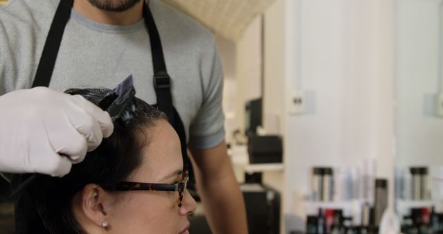 Hairdresser Applying Color to Client's Hair in Modern Salon - Download Free Stock Images Pikwizard.com