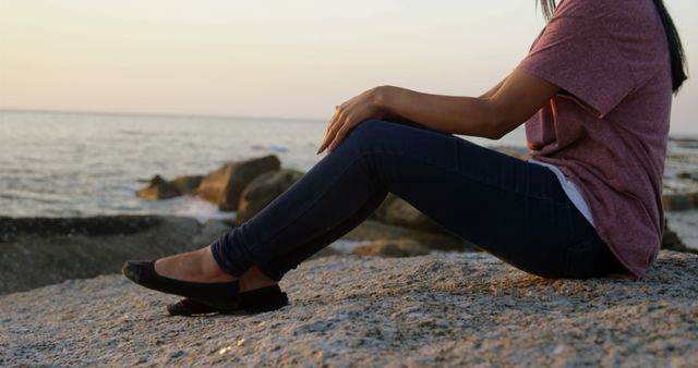 Woman Relaxing by Ocean Sunset Reflecting Serenity and Peace - Download Free Stock Images Pikwizard.com