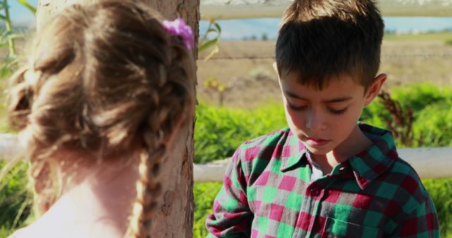 Two Children with Braided Hair and Plaid Shirt in Countryside - Download Free Stock Images Pikwizard.com