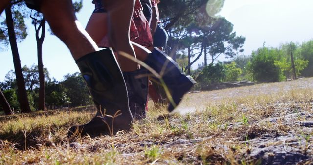 Close-up of People Walking Outdoors Wearing Boots - Download Free Stock Images Pikwizard.com