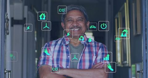 Smiling senior man showcasing sustainable home energy, smart home and green tech icons