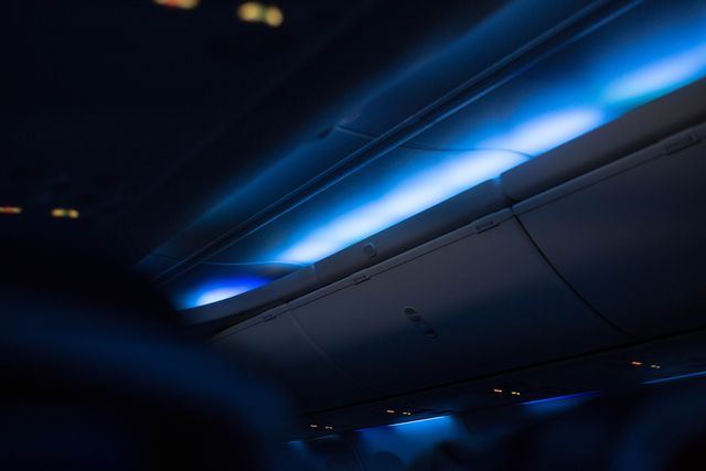 Aircraft Cabin Interior with Blue Mood Lighting - Download Free Stock Photos Pikwizard.com