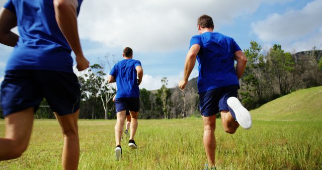 Three Men Running in Park on Sunny Day - Download Free Stock Images Pikwizard.com