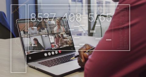 Businessman Engaged in Virtual Meeting Using Laptop