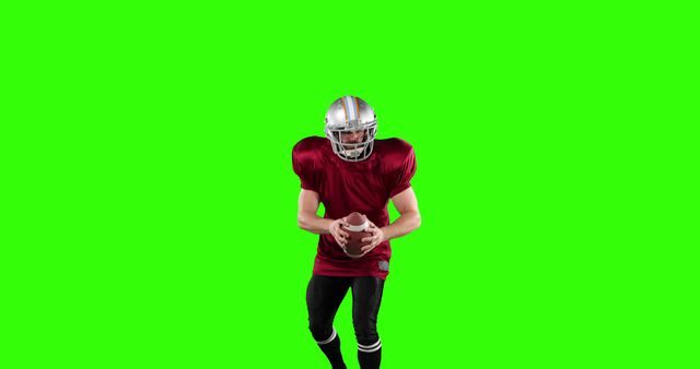 American Football Player Holding Ball Isolated on Green Background - Download Free Stock Images Pikwizard.com