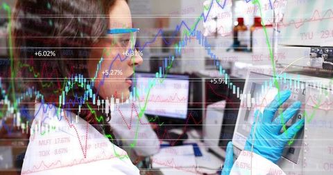 Lab technician using touchscreen with stock market overlay visualizing data-driven science