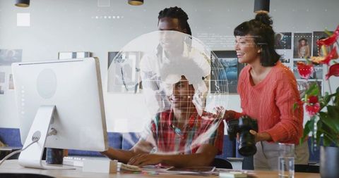 Creative Teamwork Analyzing Data with a Digital Globe in Modern Office