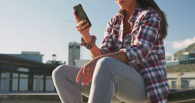 Young Woman Texting Outdoors in Urban Setting - Download Free Stock Images Pikwizard.com