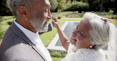 Senior Couple Dancing Joyfully at Outdoor Wedding Ceremony