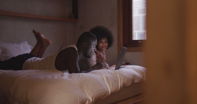 Couple Relaxing in Bed Using Laptop in Cozy Bedroom - Download Free Stock Images Pikwizard.com