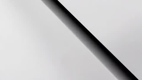 Zooming toward curved monochrome band revealing expanding dark core, minimal abstract motion loop