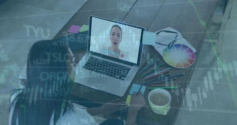 Woman engaged in video call during creative note-taking session